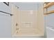 Full tub and shower with a shower head and shelving at 4049 Fairway Lakes Dr. # 4049, Myrtle Beach, SC 29577