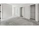 Bedroom with two bi-fold closets, carpet, and neutral walls at 4049 Fairway Lakes Dr. # 4049, Myrtle Beach, SC 29577