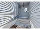 Close up shot of the home's entrance with a small window and light hanging above the door at 4049 Fairway Lakes Dr. # 4049, Myrtle Beach, SC 29577