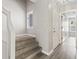 Inviting entryway with neutral paint, carpeted stairs, and wood-look flooring, bathed in natural light at 4049 Fairway Lakes Dr. # 4049, Myrtle Beach, SC 29577