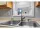 The kitchen features a stainless steel faucet with pull down sprayer and a window at 4049 Fairway Lakes Dr. # 4049, Myrtle Beach, SC 29577