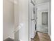 Convenient laundry area with stacked washer and dryer near the stairs at 4049 Fairway Lakes Dr. # 4049, Myrtle Beach, SC 29577