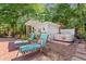 Secluded backyard with lounge chairs, hot tub, cabana, and lush greenery at 41 Sunfield Dr., Calabash, SC 28467