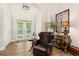 Elegant foyer features a decorative glass door, hardwood floors, and tasteful furnishings at 41 Sunfield Dr., Calabash, SC 28467