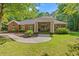 Stunning brick home with a symmetrical facade, a portico entry, and a beautifully landscaped front yard at 41 Sunfield Dr., Calabash, SC 28467