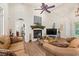 Inviting living room features vaulted ceilings, a fireplace, and comfortable leather seating at 41 Sunfield Dr., Calabash, SC 28467