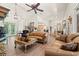 Spacious living room with ample seating, hardwood floors, a fireplace, and access to the backyard at 41 Sunfield Dr., Calabash, SC 28467
