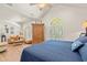 The main bedroom offers a sitting area, arched windows with shutters, and vaulted ceilings at 41 Sunfield Dr., Calabash, SC 28467
