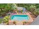 Aerial view of pool, cabana, and lush backyard landscaping, creating a private oasis at 41 Sunfield Dr., Calabash, SC 28467
