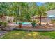 Overhead view showcases pool, lounge area, cabana, and a lush, private backyard at 41 Sunfield Dr., Calabash, SC 28467