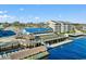 Aerial view of waterfront dining with boat access and multiple levels of outdoor seating overlooking the water at 413 Goldenrod Circle # 2B, Little River, SC 29566