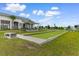 Outdoor bocce ball court near a clubhouse, set against a backdrop of a beautiful blue sky at 413 Goldenrod Circle # 2B, Little River, SC 29566