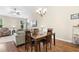 Open concept dining and living area, with hardwood floors and natural light at 413 Goldenrod Circle # 2B, Little River, SC 29566