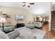 Inviting living room with vaulted ceiling, plush seating, and an open flow to kitchen at 413 Goldenrod Circle # 2B, Little River, SC 29566