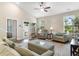 Spacious living room featuring neutral tones, comfortable seating, and lots of natural light at 413 Goldenrod Circle # 2B, Little River, SC 29566