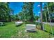 Backyard featuring an installed Generac generator, propane tank, grass and trees at 4189 Schoolhouse Circle, Little River, SC 29566
