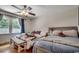 Comfortable bedroom with hardwood floors, two beds, a window, and a ceiling fan at 4189 Schoolhouse Circle, Little River, SC 29566