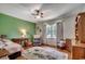 Bedroom with a desk, chair, bed, and a large area rug on hardwood floors at 4189 Schoolhouse Circle, Little River, SC 29566