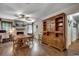 Dining area boasts hardwood floors, a large china cabinet, and a view of the fireplace at 4189 Schoolhouse Circle, Little River, SC 29566