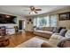 Cozy living room with hardwood floors, comfortable seating, and a large window at 4189 Schoolhouse Circle, Little River, SC 29566