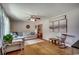 Bright living room with hardwood floors, a plush couch, and charming decor at 4189 Schoolhouse Circle, Little River, SC 29566
