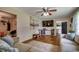 Cozy living room features hardwood floors, a ceiling fan, and comfortable seating at 4189 Schoolhouse Circle, Little River, SC 29566
