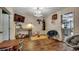 Finished room with hardwood floors, TV, workout gear, and ample space for Gathering activities at 4189 Schoolhouse Circle, Little River, SC 29566