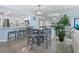 Modern dining area with stylish table and chairs, adjacent to kitchen, with large mirror reflecting ocean view at 5511 N Ocean Blvd. # 1801, Myrtle Beach, SC 29577