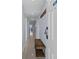 Inviting condo hallway leads to living area with ocean view; modern, tile flooring, neutral walls and beachy decor at 5511 N Ocean Blvd. # 1801, Myrtle Beach, SC 29577