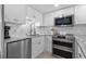Bright and modern kitchen features stainless steel appliances, granite countertops, and ample storage space at 5511 N Ocean Blvd. # 1801, Myrtle Beach, SC 29577