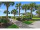 Lush landscaping featuring manicured lawns, palm trees, and a charming gazebo with serene ocean backdrop at 5511 N Ocean Blvd. # 1801, Myrtle Beach, SC 29577