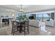 Stylish living area features a dining area, fireplace, and ocean views from large picture windows at 5511 N Ocean Blvd. # 1801, Myrtle Beach, SC 29577