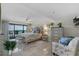 Bright main bedroom features balcony access and comfortable furniture at 5511 N Ocean Blvd. # 1801, Myrtle Beach, SC 29577