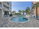 Small outdoor pool with a tiled deck, surrounded by lounge chairs and palm trees for a luxurious experience at 5511 N Ocean Blvd. # 1801, Myrtle Beach, SC 29577