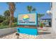 Attractive Forest Dunes sign with a bright, sunny logo located on a beautifully landscaped property at 5511 N Ocean Blvd. # 1801, Myrtle Beach, SC 29577