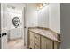 Bathroom featuring a white vanity, decorative lighting and coordinating flooring at 5523 North Ocean Blvd. # 803, Myrtle Beach, SC 29577