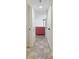 Inviting hallway leading to a bright living space with neutral tile flooring at 5523 North Ocean Blvd. # 803, Myrtle Beach, SC 29577