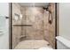 Updated shower with tiled surround, glass enclosure, and modern shower head at 5523 North Ocean Blvd. # 803, Myrtle Beach, SC 29577