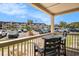 View from a balcony showing a table and chairs with a parking lot and building in the background at 5601 N Ocean Blvd. # E-113, Myrtle Beach, SC 29577