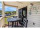Enjoy outdoor dining on this cozy balcony with seating and scenic community views at 5601 N Ocean Blvd. # E-113, Myrtle Beach, SC 29577