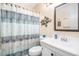 Well-lit bathroom featuring a shower/tub combo and a vanity with storage at 5601 N Ocean Blvd. # E-113, Myrtle Beach, SC 29577