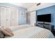 Inviting bedroom with a flat-screen TV and ample closet space for storage at 5601 N Ocean Blvd. # E-113, Myrtle Beach, SC 29577