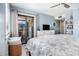 Cozy bedroom featuring access to a private balcony with picturesque views at 5601 N Ocean Blvd. # E-113, Myrtle Beach, SC 29577