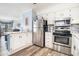 Bright and modern kitchen featuring stainless steel appliances, white cabinetry and an open concept design at 5601 N Ocean Blvd. # E-113, Myrtle Beach, SC 29577