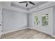 Spacious bedroom features wood floors, a ceiling fan, and doors to the outside at 6001-Mh13A S Kings Hwy., Myrtle Beach, SC 29575