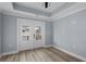 Serene bedroom showcasing access to a balcony, ceiling fan, and light walls at 6001-Mh13A S Kings Hwy., Myrtle Beach, SC 29575