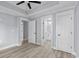 Bedroom with wood floors and white doors leading to other rooms at 6001-Mh13A S Kings Hwy., Myrtle Beach, SC 29575