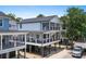 Stunning exterior view of this stilt house with multiple decks and a car at 6001-Mh13A S Kings Hwy., Myrtle Beach, SC 29575