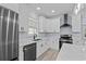 Beautiful kitchen with marble countertops, an island, black stainless appliances, and white cabinets at 6001-Mh13A S Kings Hwy., Myrtle Beach, SC 29575