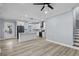 Spacious kitchen with black stainless appliances, light wood floors, a kitchen island, and white cabinets at 6001-Mh13A S Kings Hwy., Myrtle Beach, SC 29575